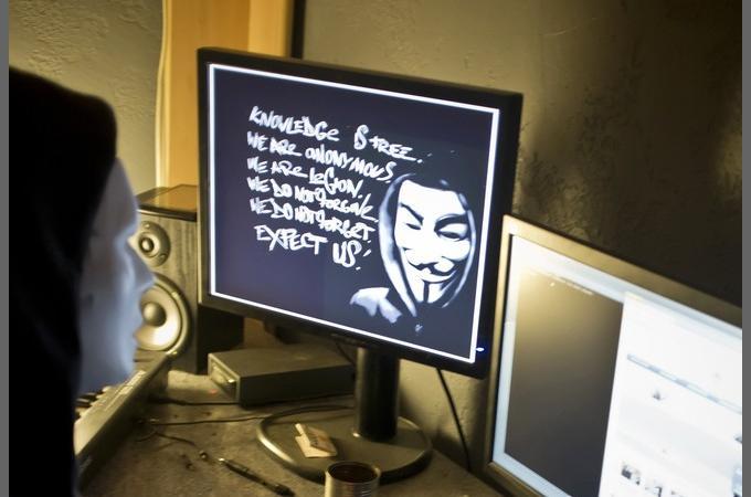 A masked hacker, part of the Anonymous g