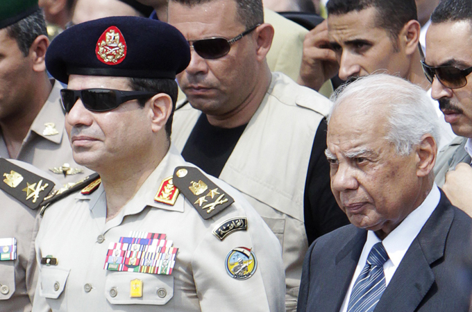 Army Chief General Abdel Fattah al-Sisi (L) and interim-Prime Minister Hazem el-Beblawi [Reuters]