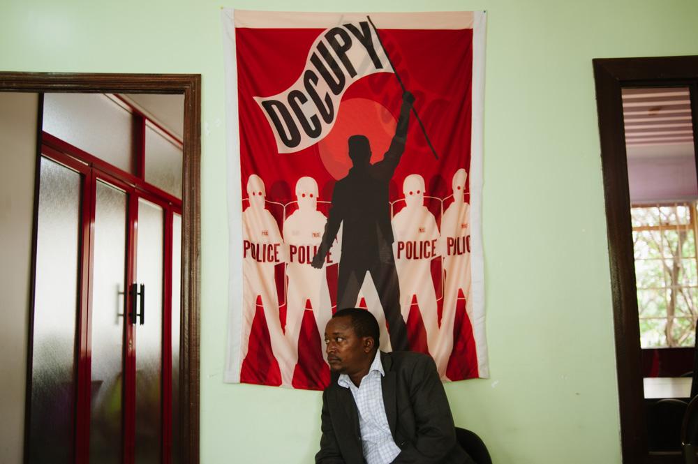 <p>A Kenyan man sits in an arts centre in Nairobi, used as a rallying point for the protest, under the banner of the global "Occupy" movement.</p>