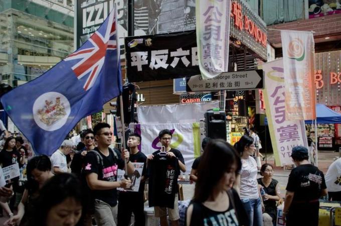 Many Hong Kong youth want China to hold true to its promise of 'one country, two systems' pledge [AFP]
