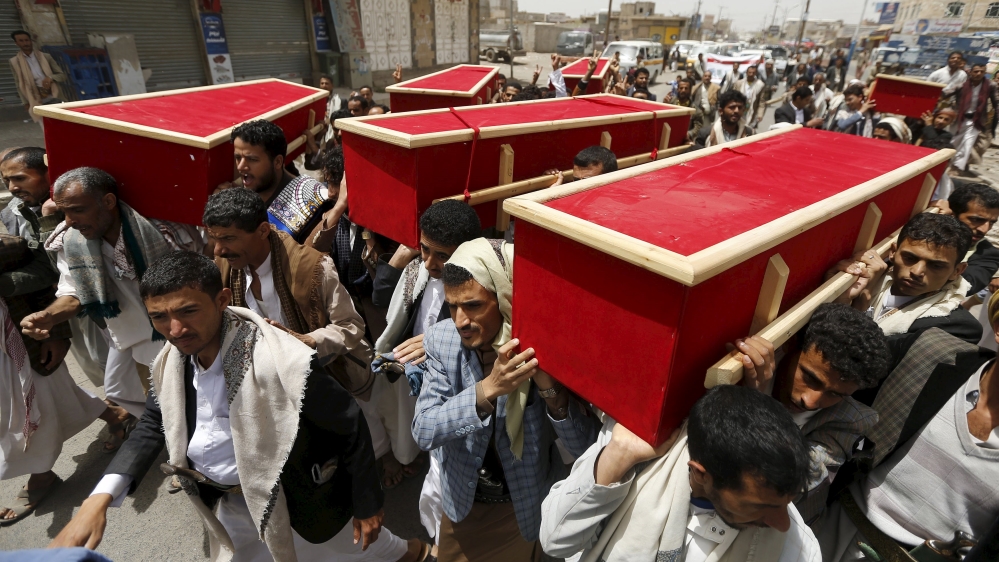 People carry the coffins of victims of a Saudi-led air strike, during their funeral in Sanaa