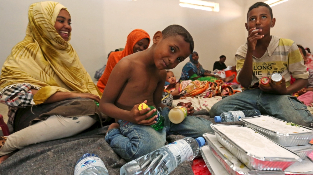 Yemeni children wait to eat donated food at a temporary shelter after fleeing violence with their families in Yemen, at the port town Bosasso in Somalia''s Puntland