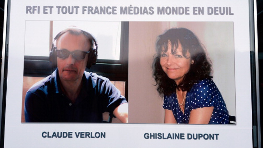 The portraits of the two journalists working for Radio France Internationale shot dead in Mali - Ghislaine Dupont and Claude Verlon [Getty]