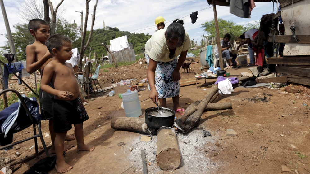 Paraguayan woman cooks in one of Paraguay''s poor neighborhoods in Asuncion