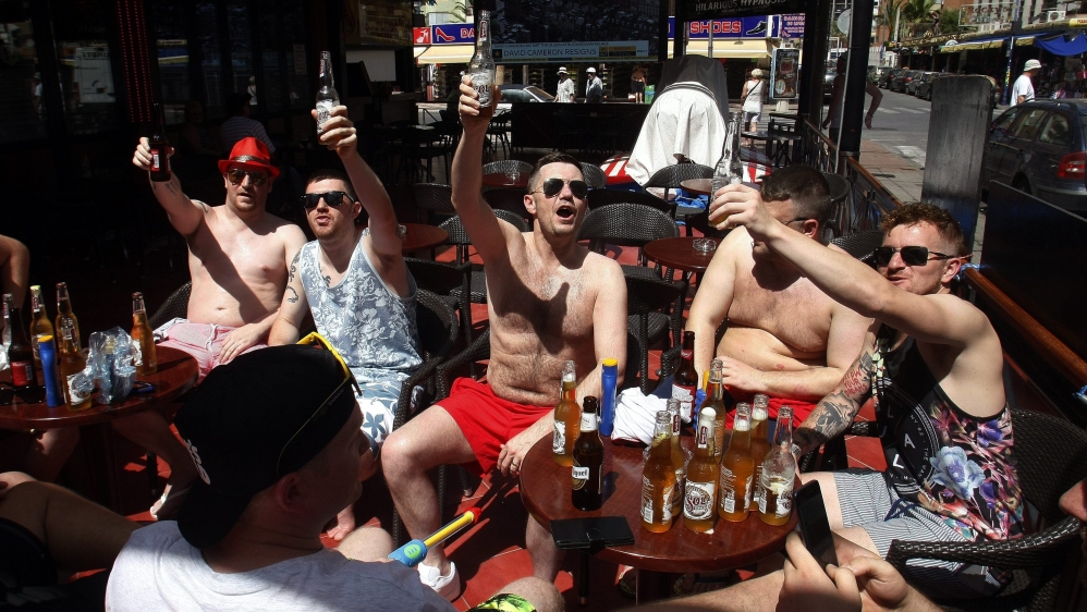 British tourists toast for the win of Brexit outside a cafe in Benidorm, Alicante, eastern Spain [EPA]