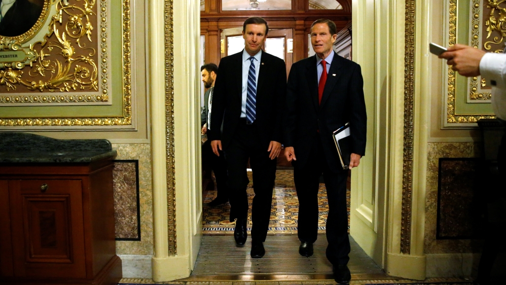 Murphy and Blumenthal depart the Senate floor directly after ending a 14-hour filibuster in the hopes of pressuring the U.S. Senate to action on gun control measures, at the U.S. Capitol in Washington