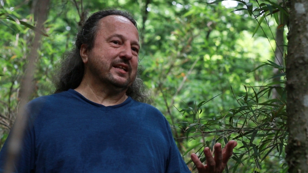 Roger Cain is one of a handful of academics studying river cane. A Cherokee, Cain is working on a project to map what remains of the river cane on Cherokee land [Nicholas Linn/Al Jazeera]
