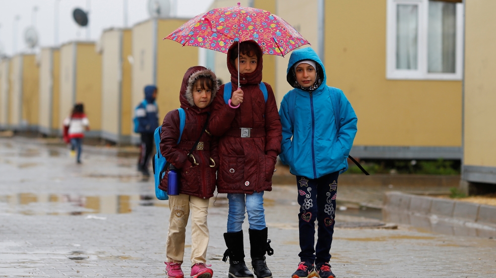 Syrian refugee children walk in Elbeyli refugee camp near the Turkish-Syrian border in Kilis province
