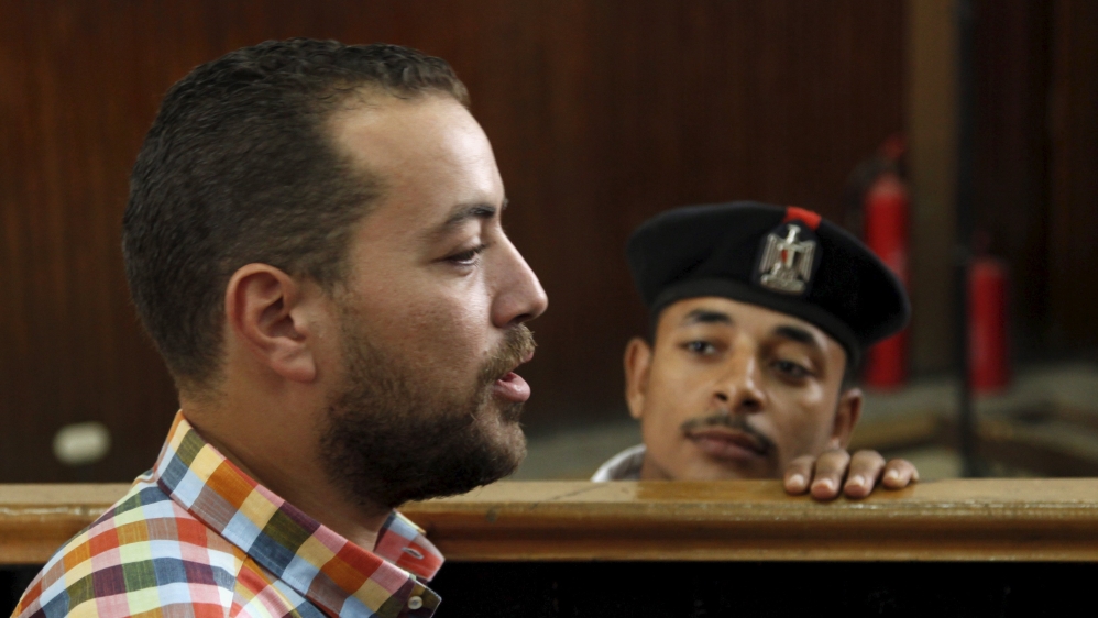 Mohamed talks to journalists before hearing the verdict at a court in Cairo