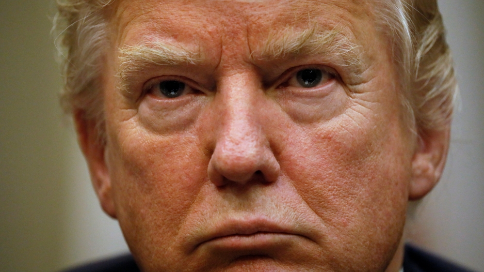 Trump looks on during meeting with police and firefighters in Washington