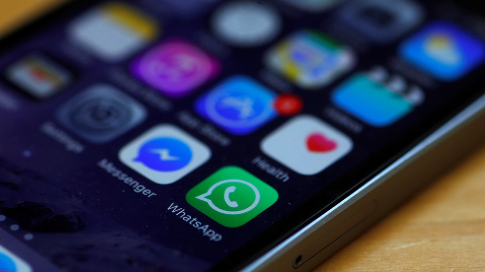 WhatsApp and Facebook messenger icons are seen on an iPhone in Manchester , Britain.
