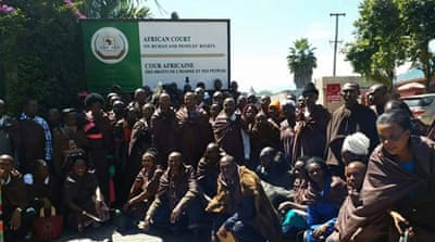 
Ogiek gather for a group photograph after a historic court ruling in their favour [Courtesy of John Samorai]
