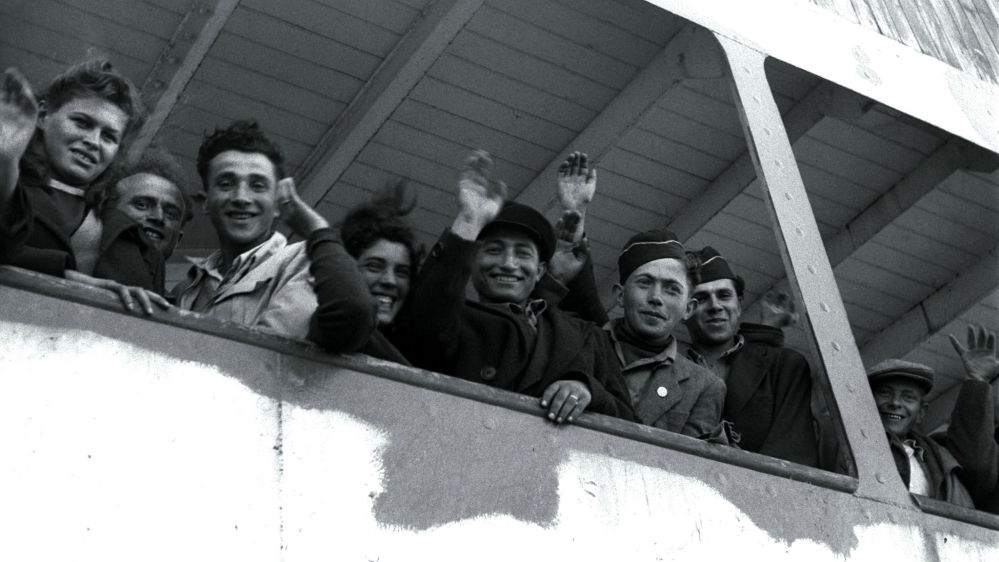 European Jews arrive from the Nazi holocaust wave into the Palestinian Arab city of Haifa, five weeks before Israel is declared a state [Reuters]