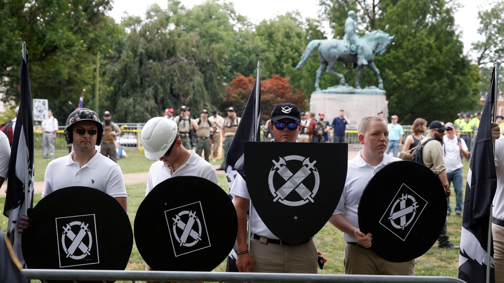 White supremacists gather under a statue of Robert E. Lee during a rally in Charlottesville, Virginia