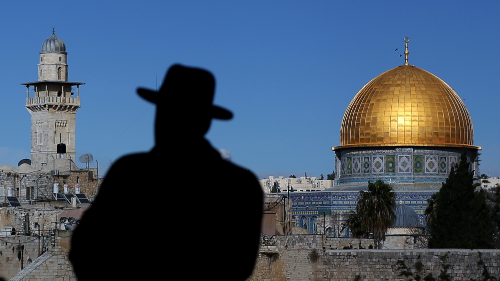Jerusalem, Israel - November 16: An ultra-Orthodox Jew with his hat in front of the Al-Aqsa mosque the Old City of Jerusalem in Israel, on November 16, 2014 in Jerusalem, Israel. (Photo by Ronny Har