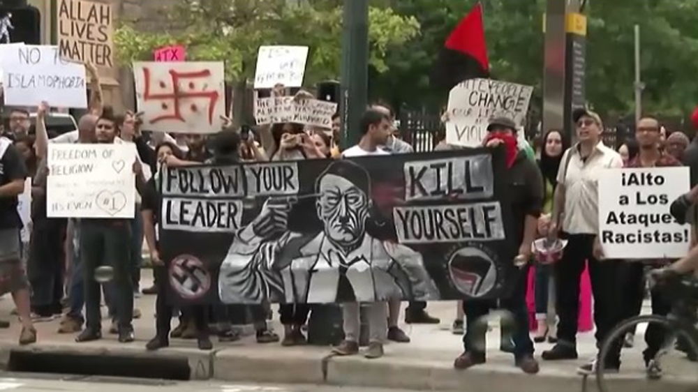 People counter protesting a “stop the Islamization of Texas” event promoted on Facebook outside the Islamic Da’Wa Center in Houston, May 2016. [Al Jazeera]