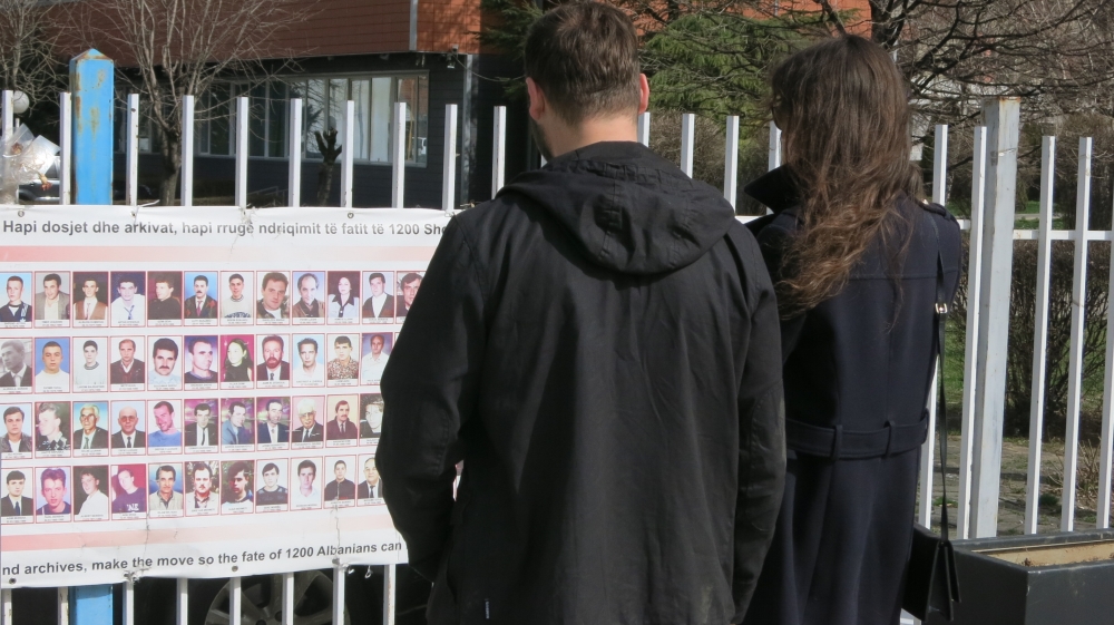Photos of the missing outside the Parliament in Pristina [Glenn Ellis/Al Jazeera]