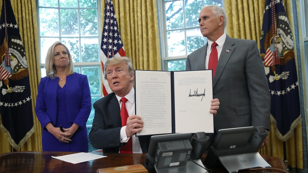 Trump signed an executive order on Wednesday detaining parents and children together [AFP]