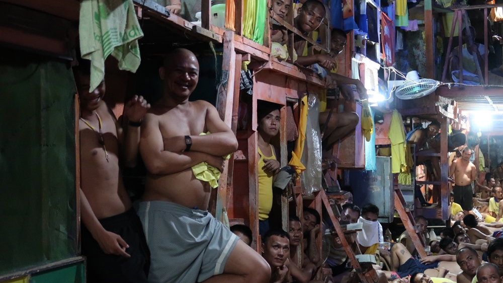 Conditions are so cramped inside the jail that inmates take up every inch of the floor [Al Jazeera]