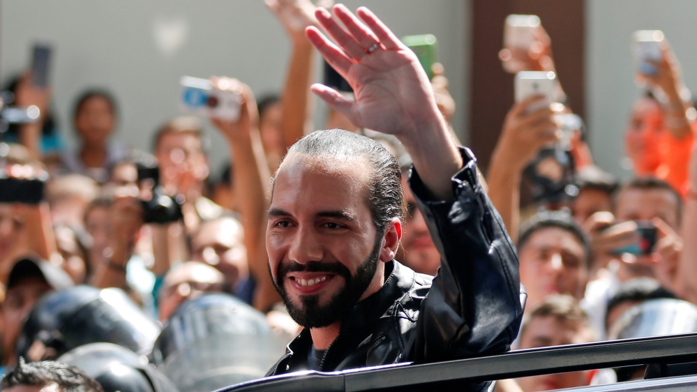 Presidential candidate Nayib Bukele of the Great National Alliance (GANA) waves after casting his vote in a presidential election in San Salvador