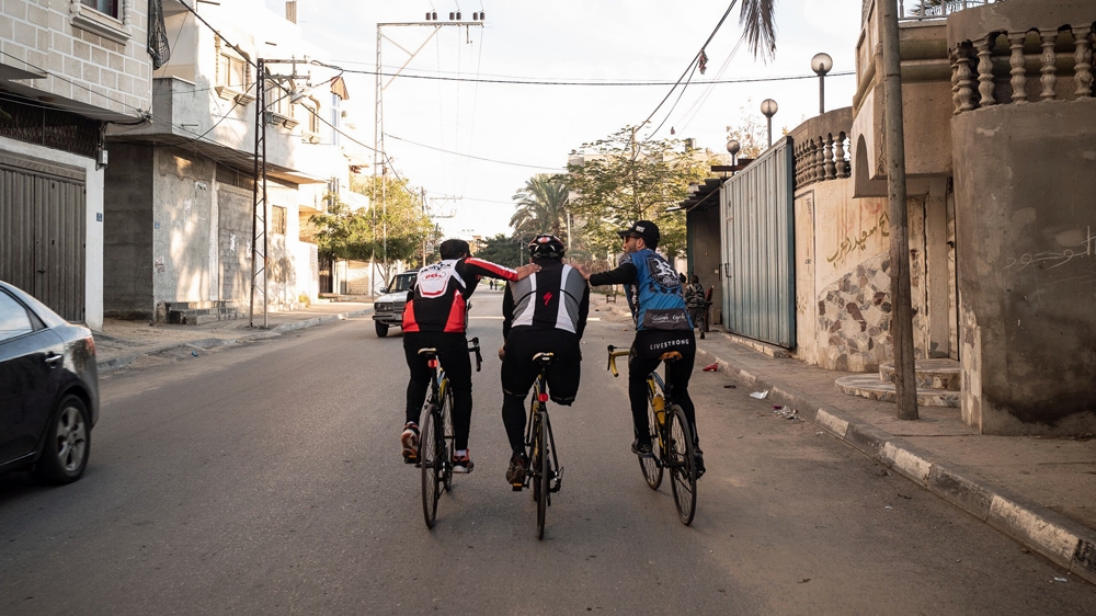 Alaa al-Dali continues pedalling with one leg, back and forth along the only flat road within the confines of Gaza