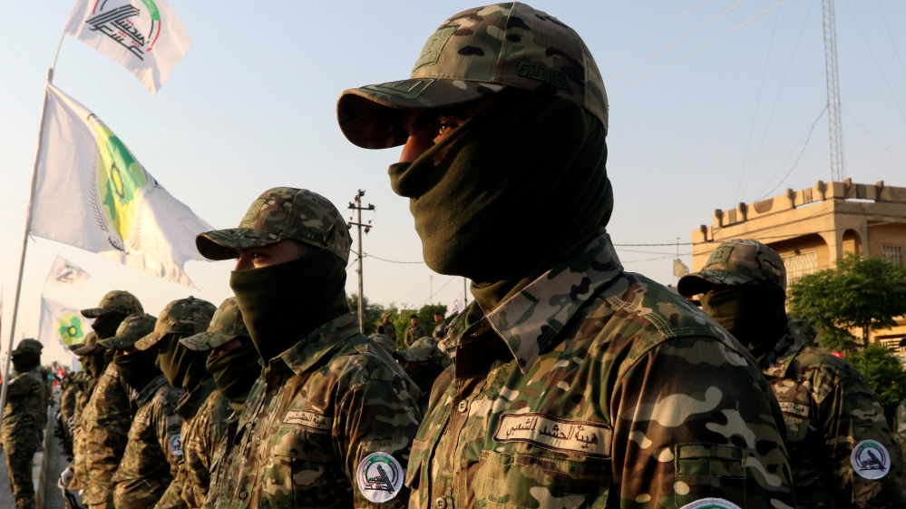 Members of Iraqi Popular Mobilization Forces (PMF) take part in a military parade in the town of Taza, south of the northern oil city of Kirkuk, Iraq June 28, 2019