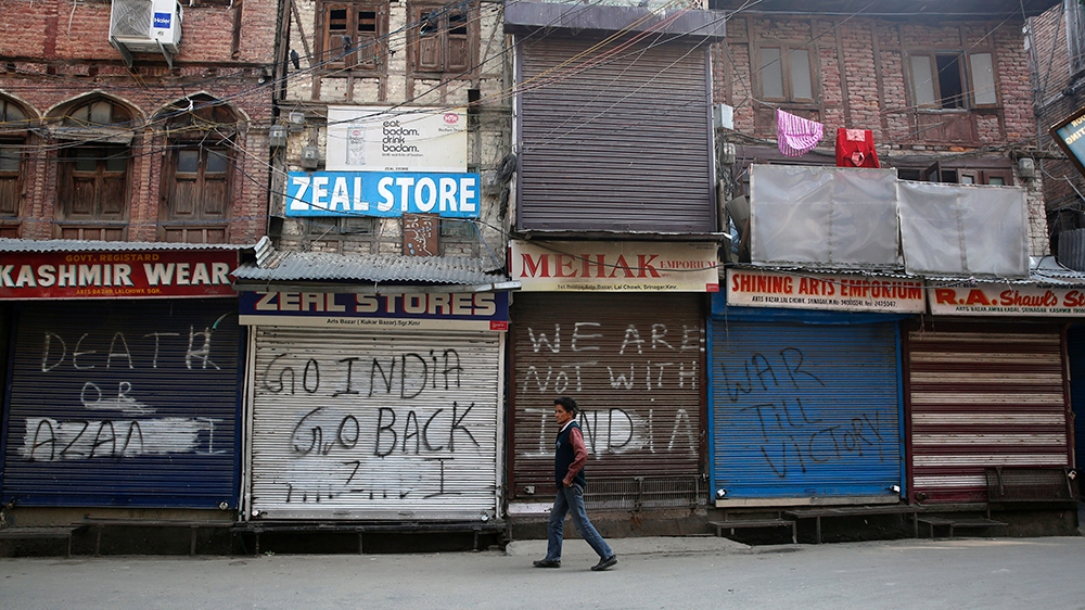 A Kashmiri man walks near closed market in Srinagar, the summer capital of Indian Kashmir, 30 October 2019. Five non-local laborers were killed and another injured by suspected militants in south Kas