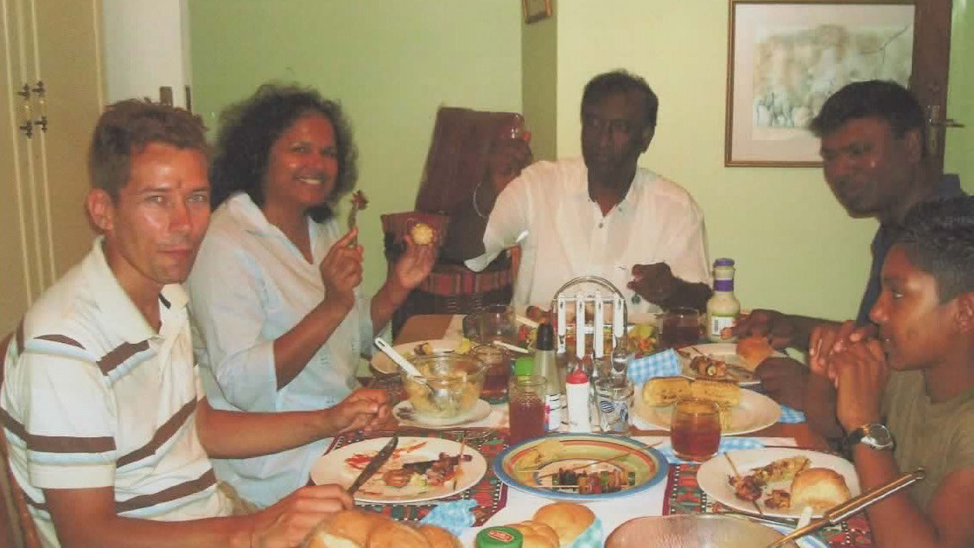The writer’s husband and parents sharing a meal, with and without cutlery [Photo courtesy: Ishay Govender-Ypma]