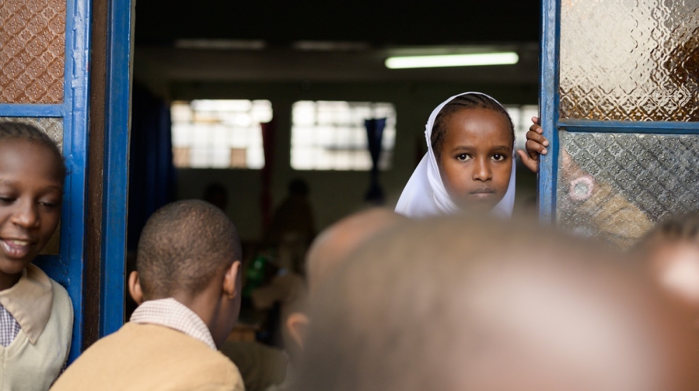 A young girl looks out of a classroom at Damascus primary school in the Nairobi slum of Karogocho
