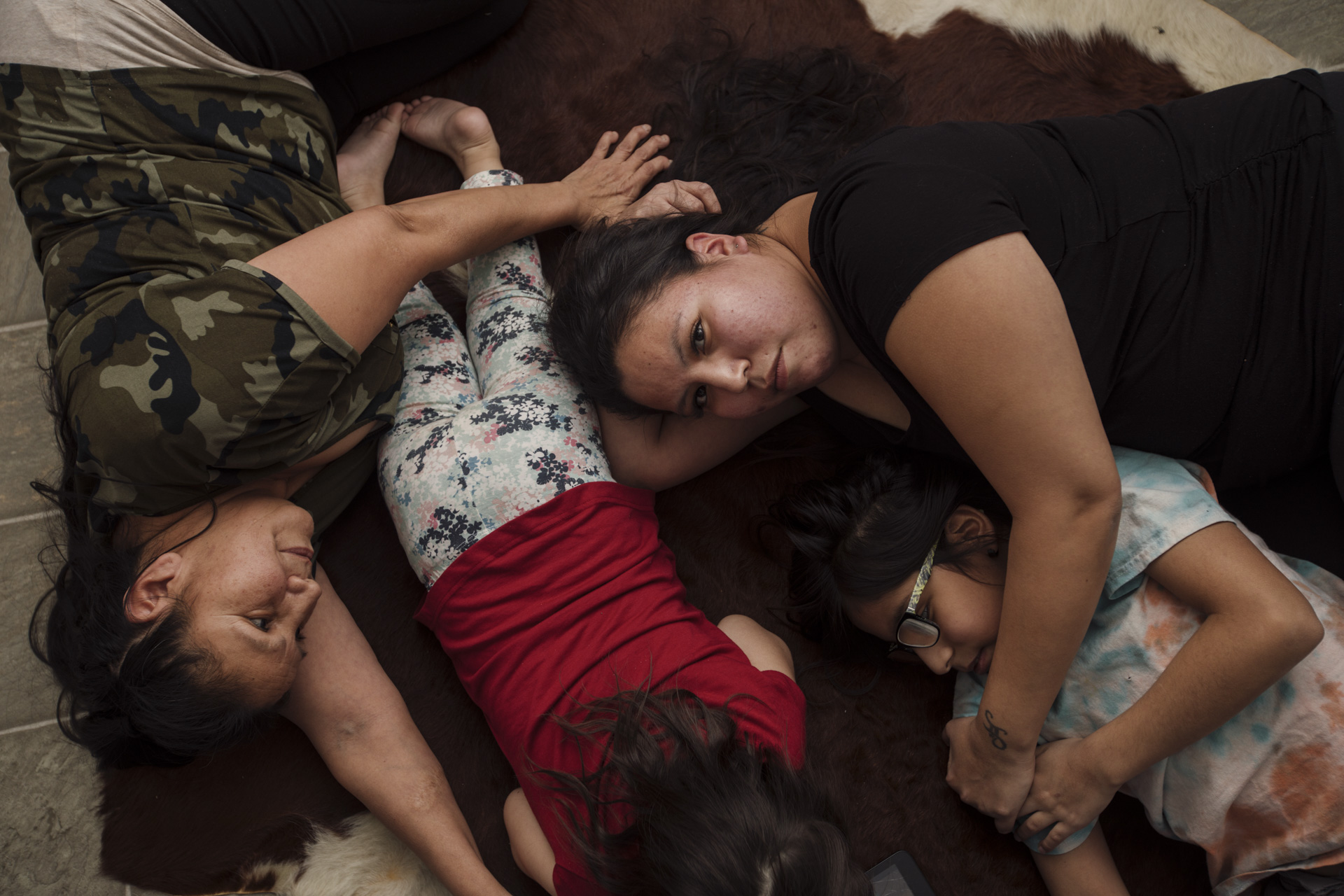 Tiya-Marie Large and her mother Elaine Sheperd shelter Mylon and Love on the basement floor during the family’s lockdown drill