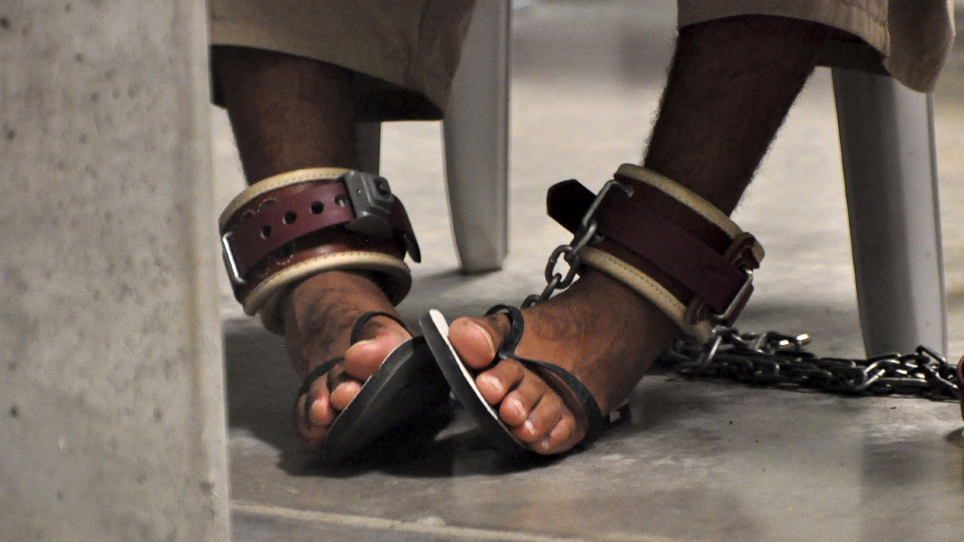 A Guantanamo detainee’s feet are shackled to the floor