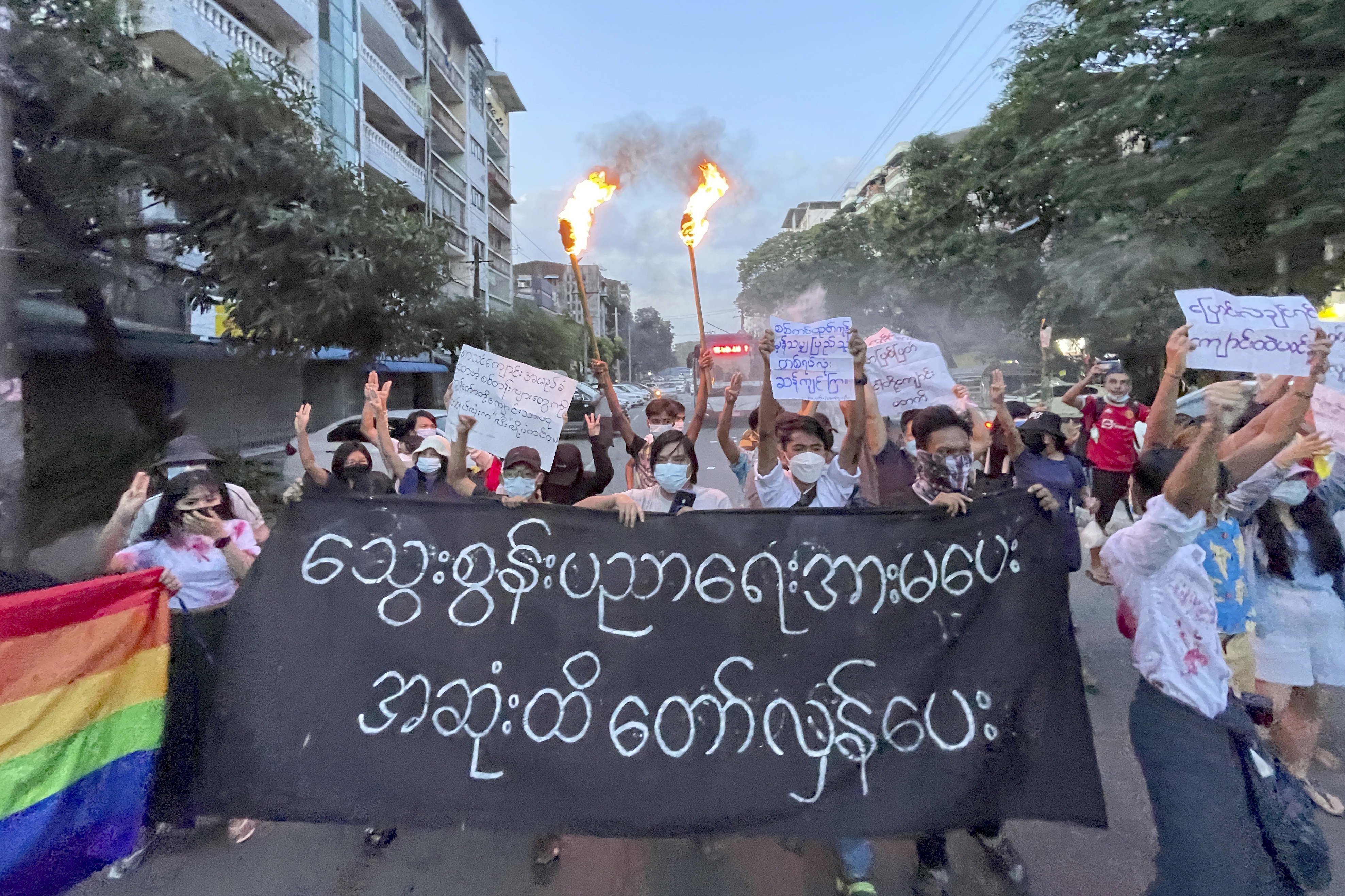 A small group of protesters call for a boycott of education as the military reopens schools again following the COVID-19 pandemic. The banner reads 'Do not support the bloody education, revolt until the end [AP Photo]