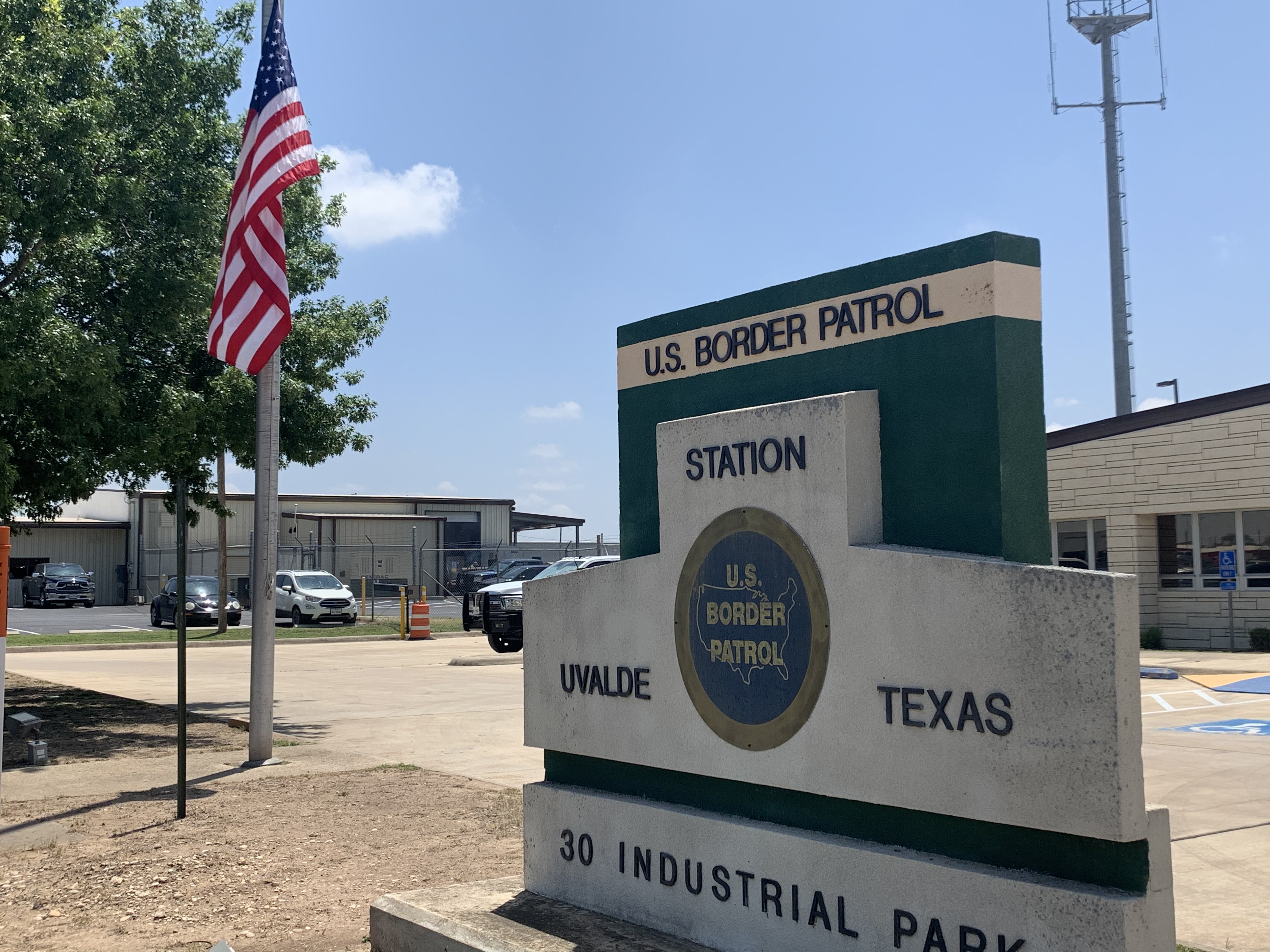 A US flag flies at half-mast outside a US Border Patrol Station in Uvalde, Texas