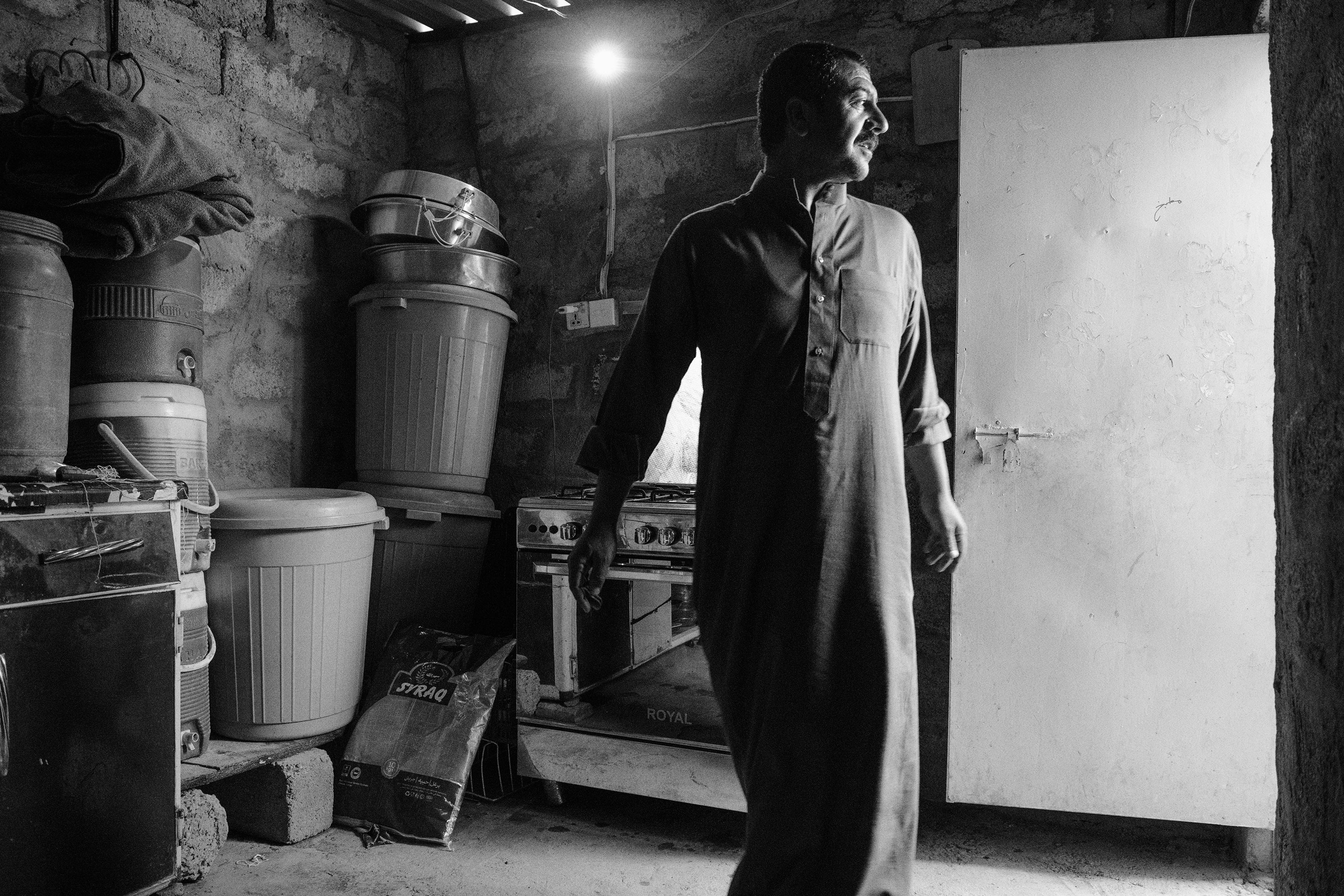 Iraq, Rabia. Waleed comes from a village near Mosul named Al-Saudia. Having no money to rebuild his destroyed house, he moved to the outskirts of Rabia, a border town with Syria. Now he lives there with his family, but the house is without running water and sewers. Before the war he used to be a shepherd, but his cattle are now gone.