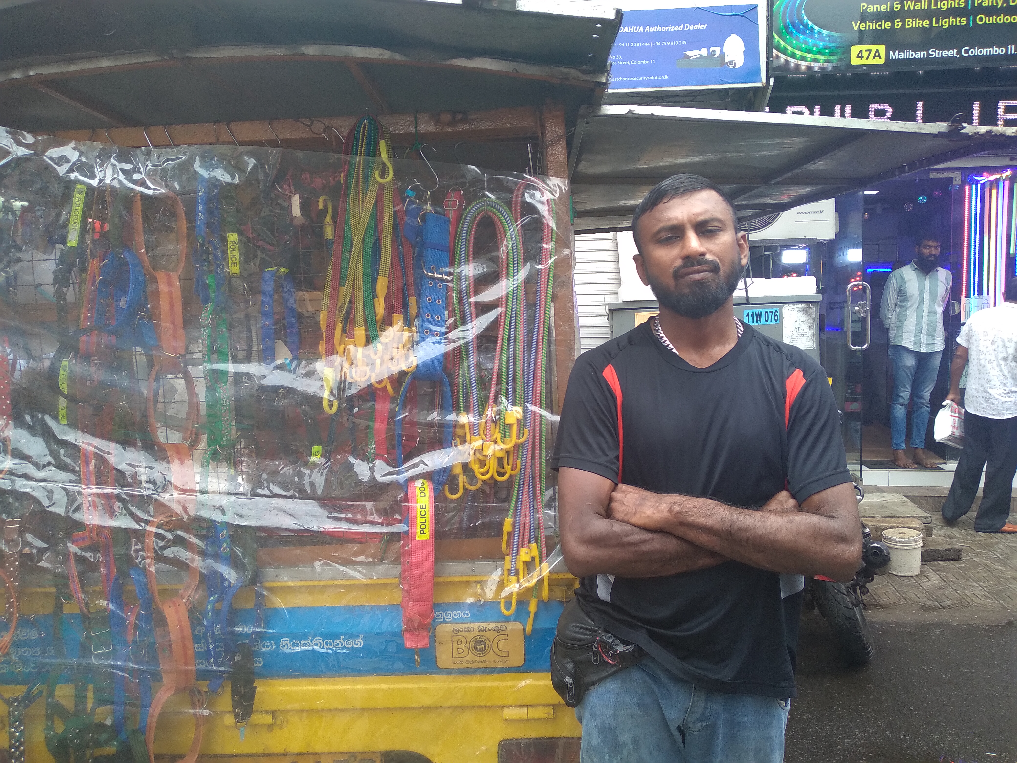 A market vendor next to his stall in Colombo, Sri Lanka.