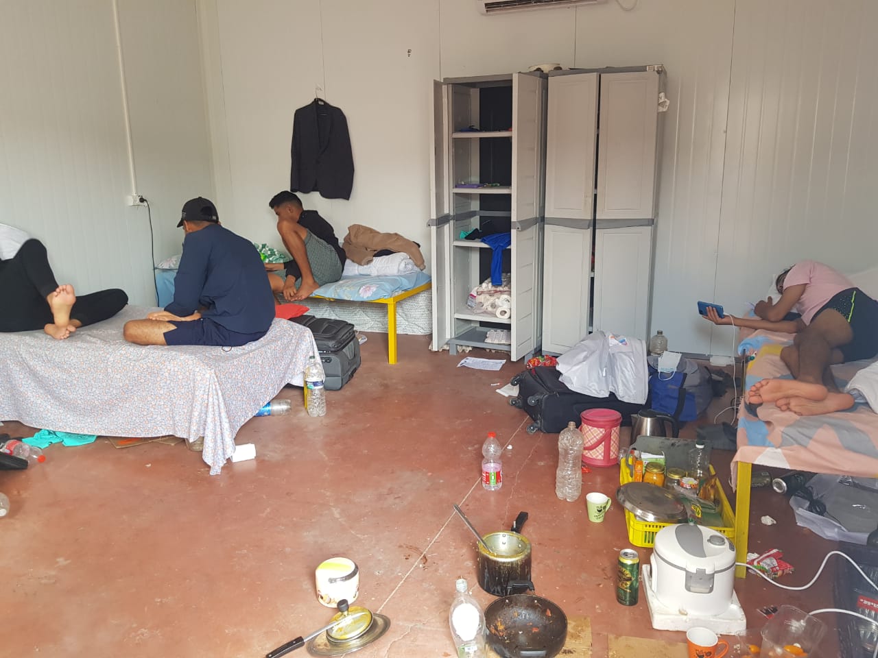 Nepali nationals gathered at a farm in Kadesh Barnea in southern Israel, from where they travelled to Ben-Gurion Airport to fly back to Nepal on October 12, 2023 [Samik Kharel/Al Jazeera]