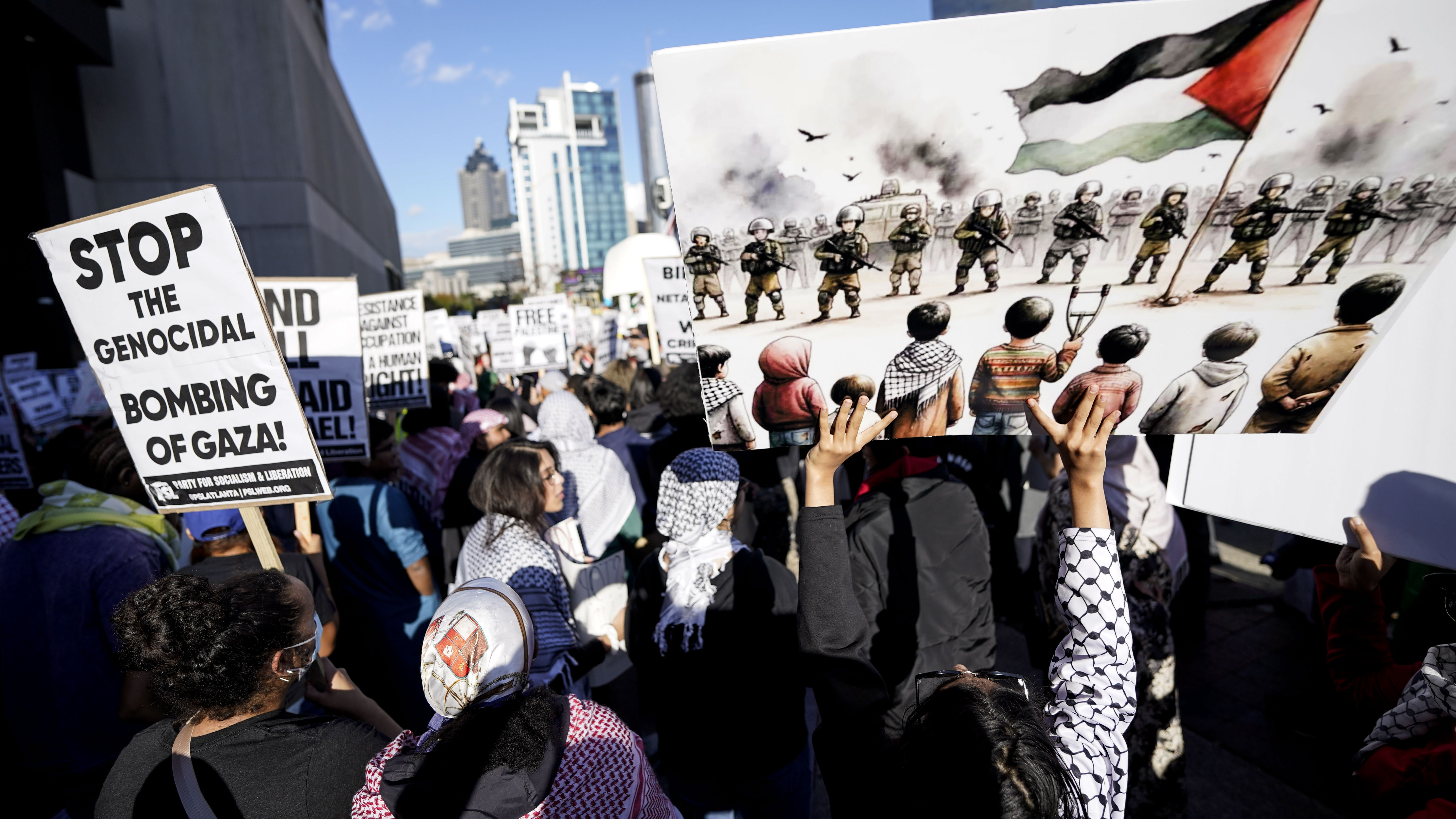 Pro-Palestinian supporters protest against Israel's bombardment of Gaza on October 20, 2023, in Atlanta [Mike Stewart/AP]