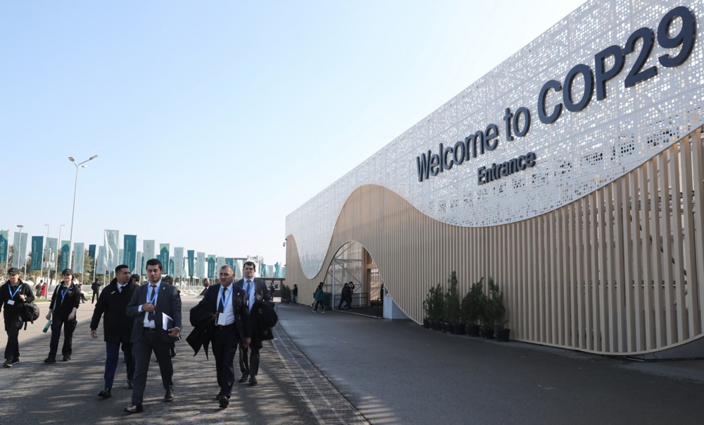 Participants arrive to attend the UN Climate Change Conference COP29 in Baku, Azerbaijan