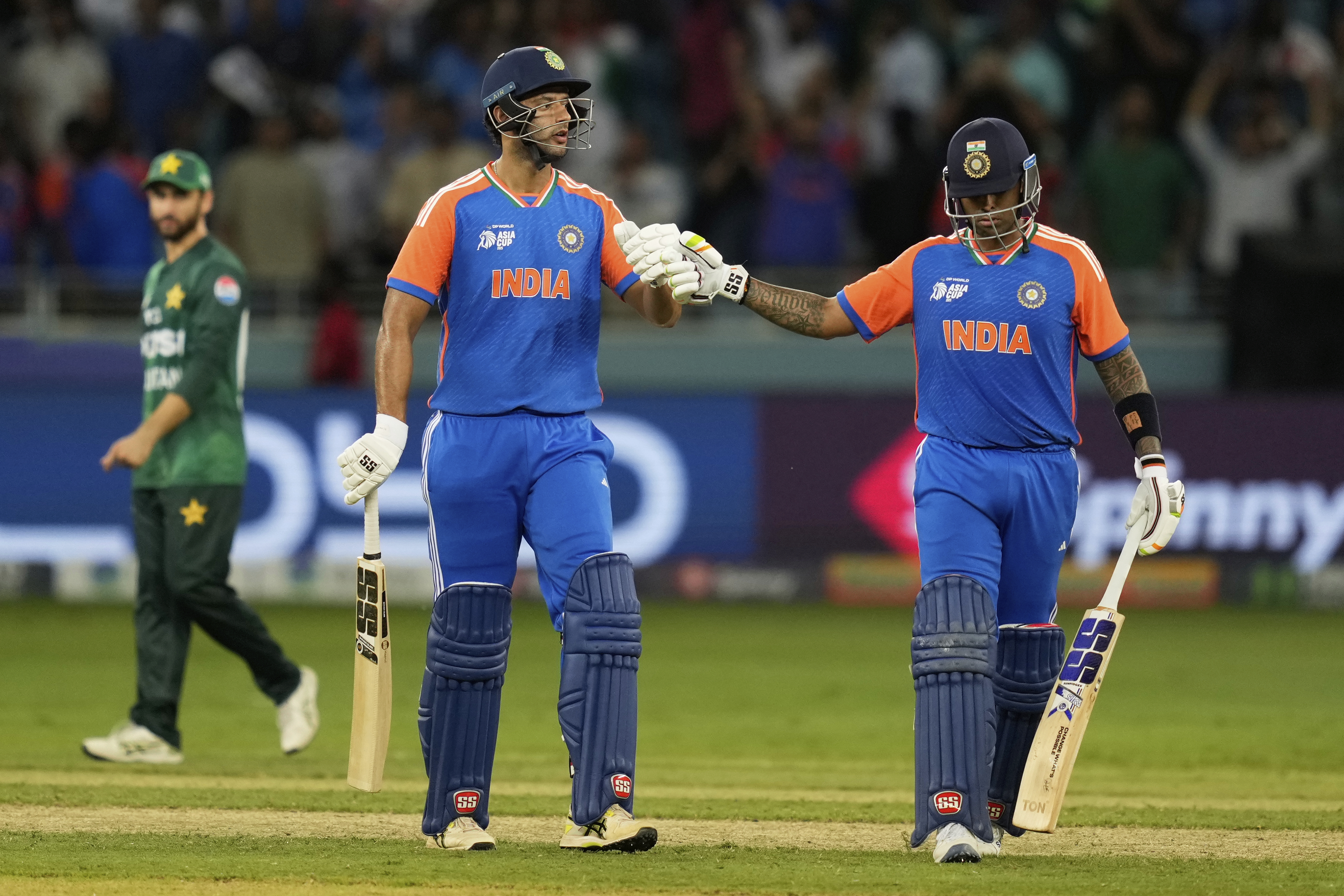 India's captain Suryakumar Yadav, right, celebrates with batting partner Shivam Dube after their win in the Asia Cup cricket match against Pakistan at Dubai International Cricket Stadium in Dubai, United Arab Emirates, Sunday, Sept. 14, 2025. (AP Photo/Altaf Qadri)