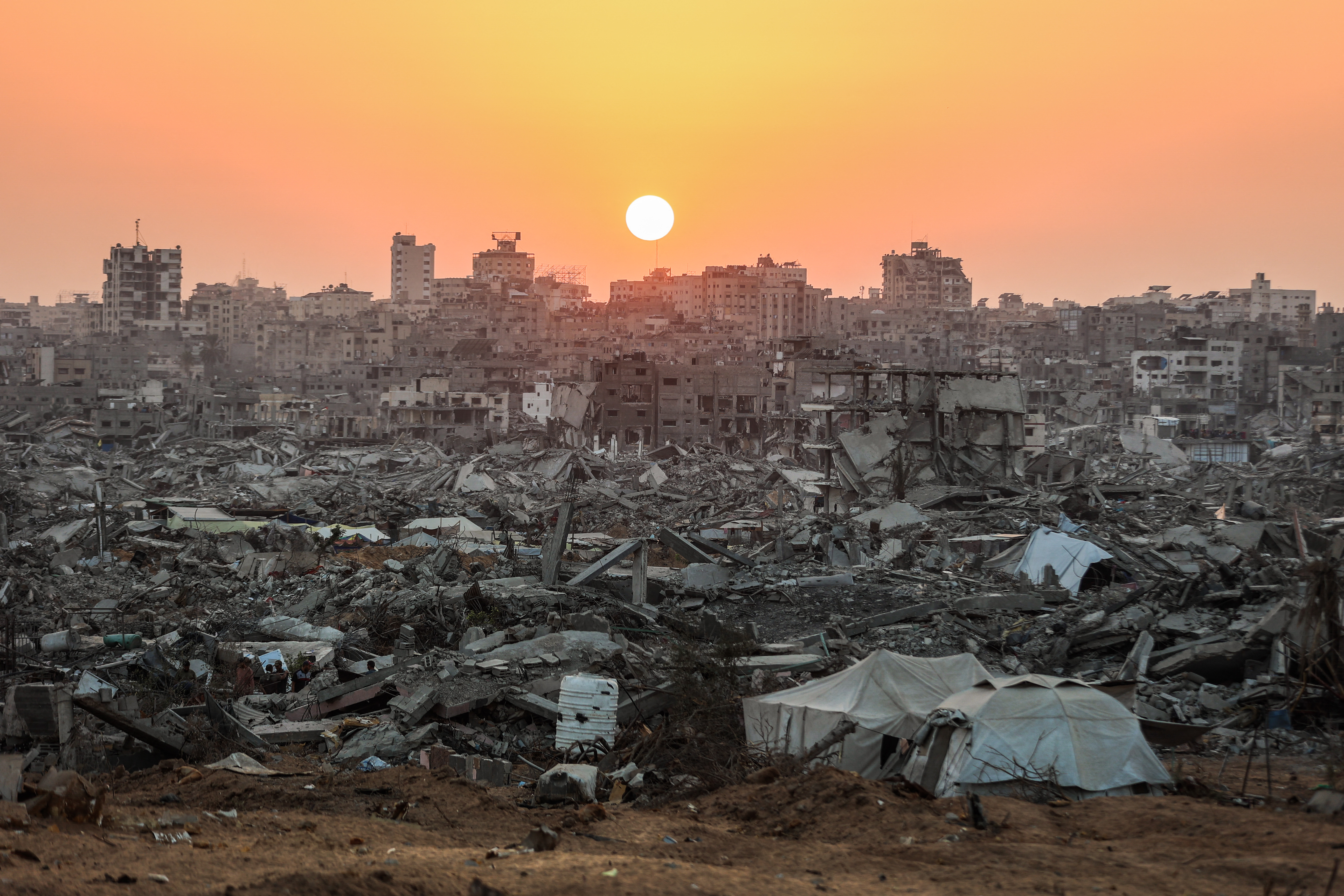 The sun sets over a heavily damaged area of Jabalia.