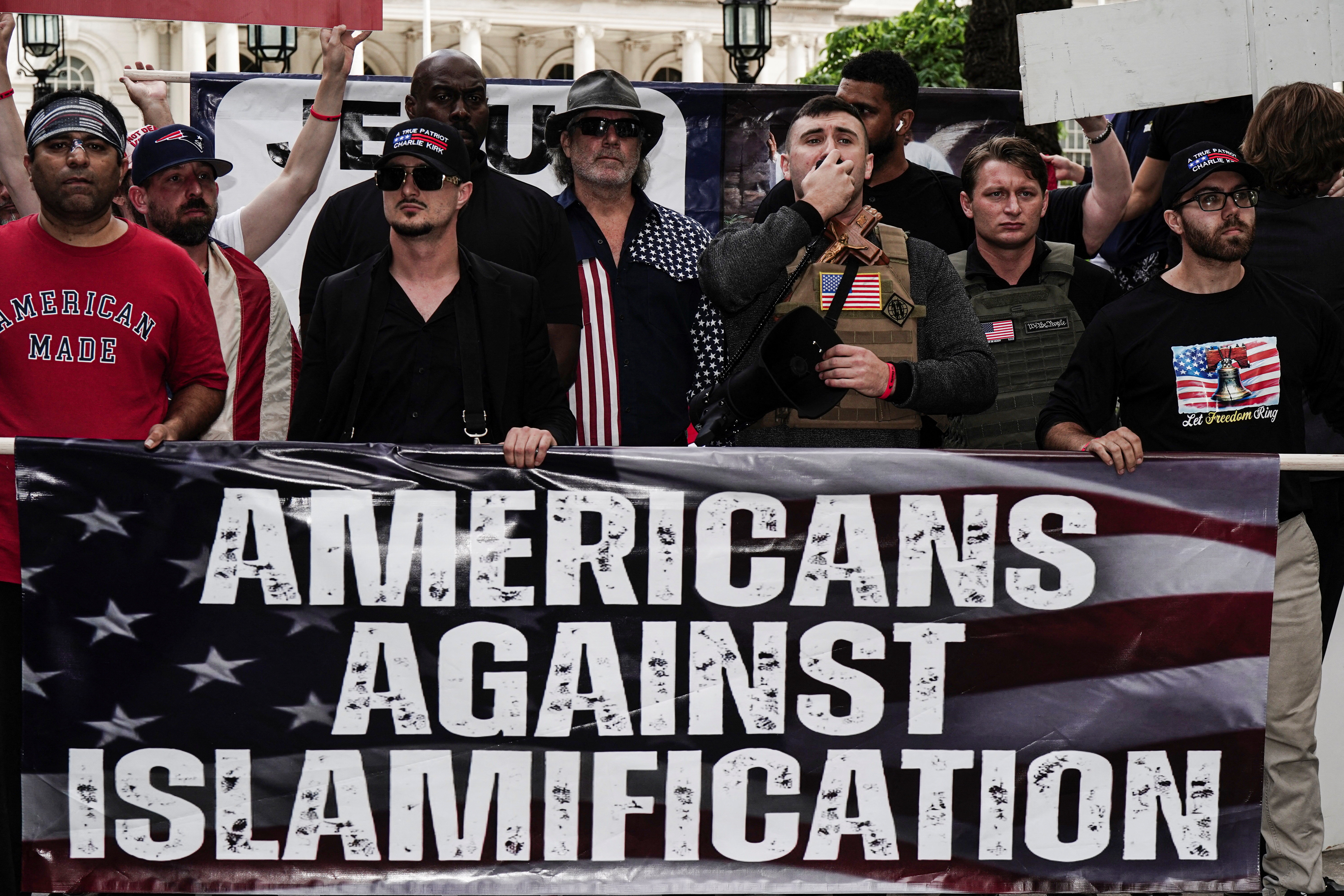 Right-wing activist Jake Lang holds a &lsquo;March on Mamdani&rsquo; rally outside New York City Hall calling for the deportation of New York Mayor Zohran Mamdani in New York City, US, on September 11, 2026 [Bing Guan/Reuters]