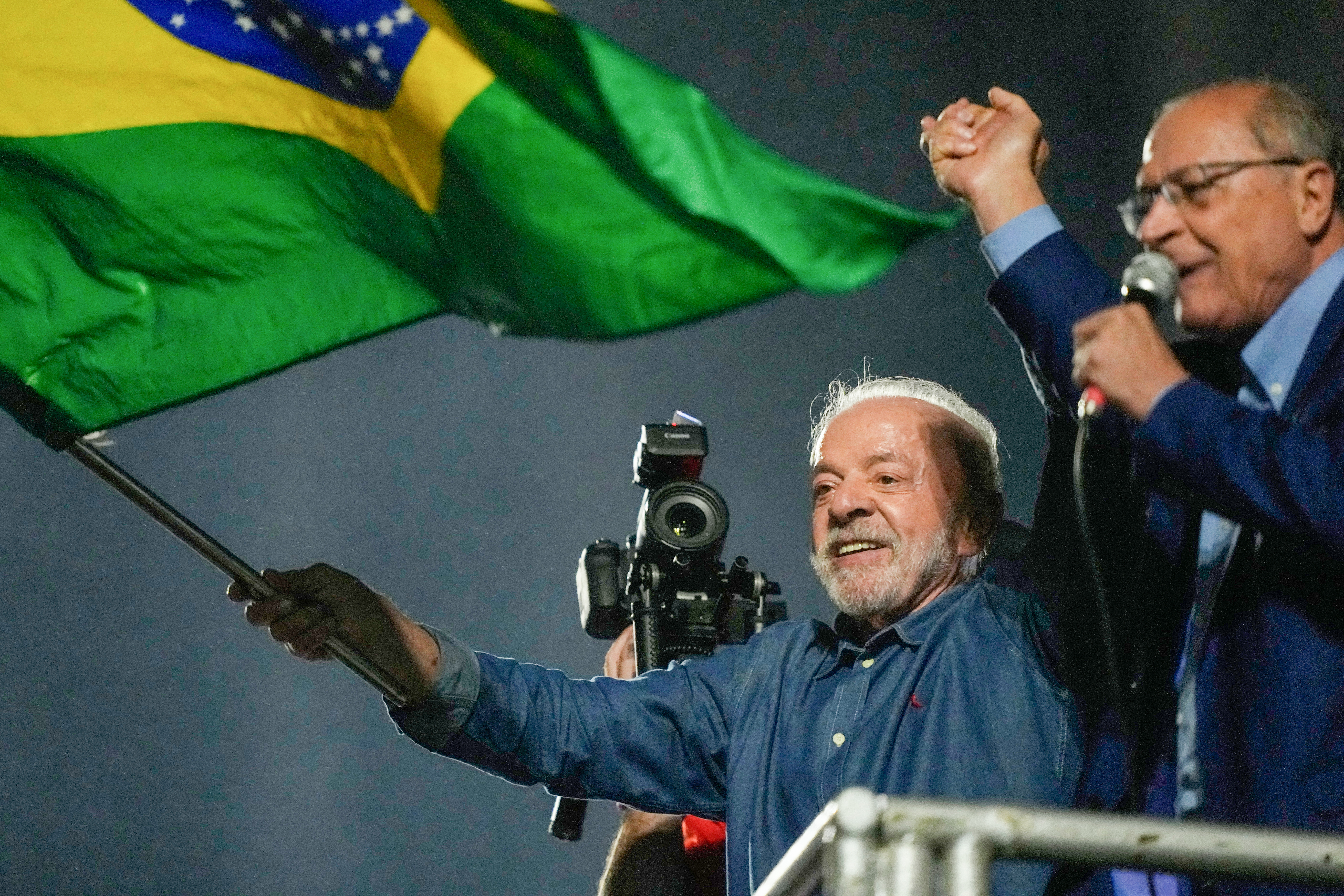President Luiz Inacio Lula da Silva and his running mate Geraldo Alckmin address supporters during a victory rally