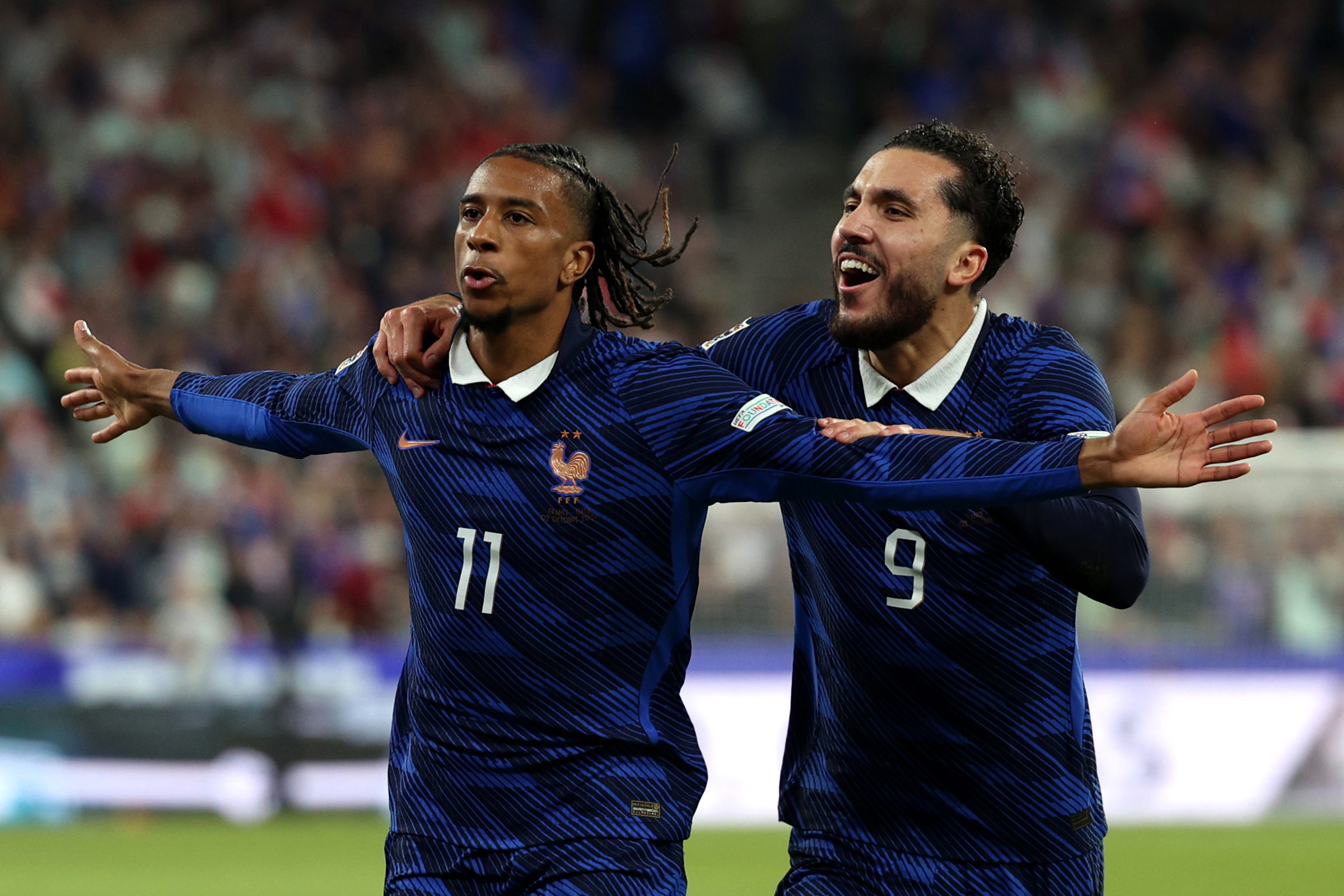 PARIS, FRANCE - OCTOBER 02: Michael Olise of France celebrates scoring his team’s first goal with teammate Rayan Cherki during the UEFA Nations League 2026/27 group phase match between France and Italy at Stade de France on October 02, 2026 in Paris, France. (Photo by Pauline Figuet/Getty Images)