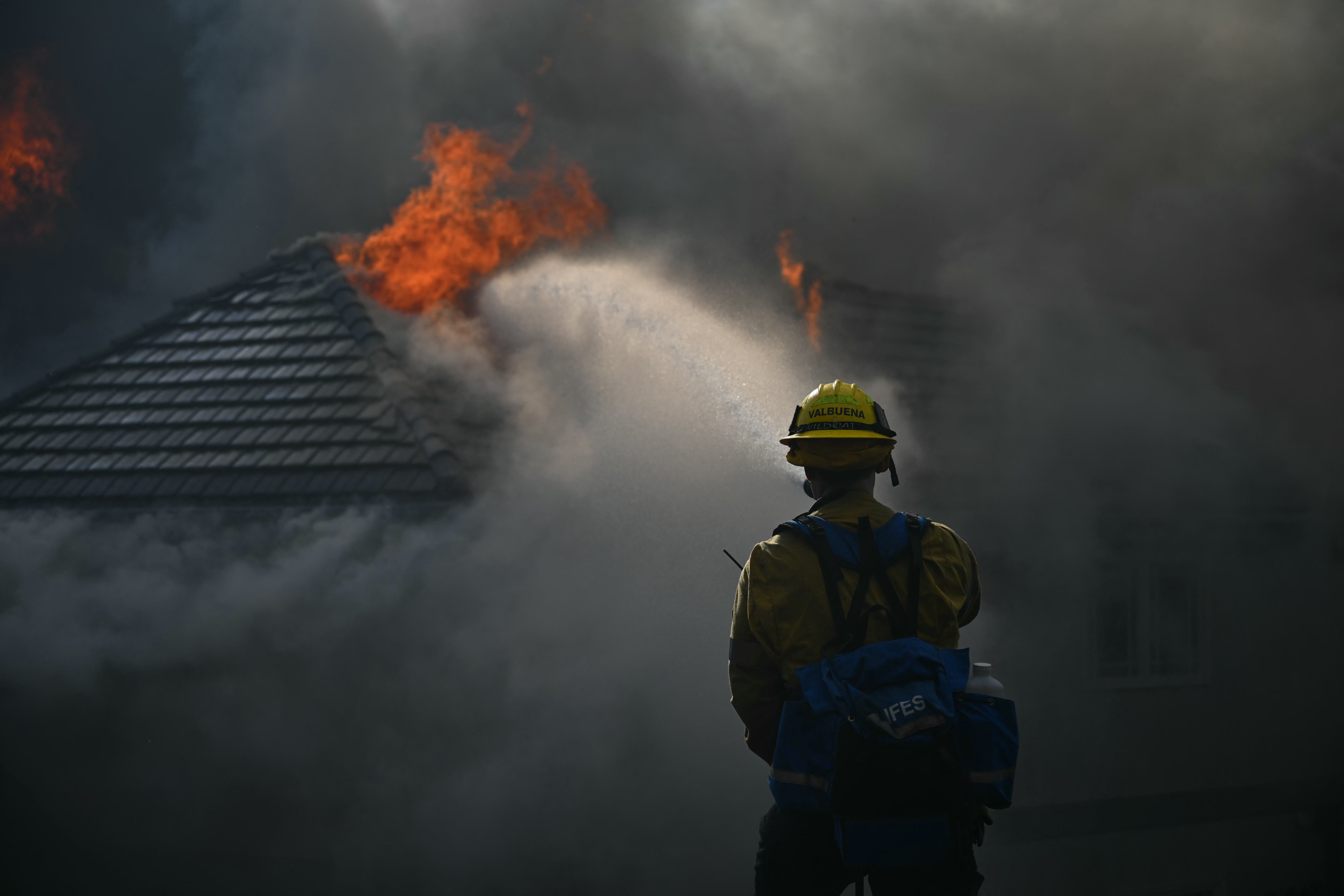 A firefighter battles the Norte Fire in San Juan Capistrano, California, on October 16, 2026.