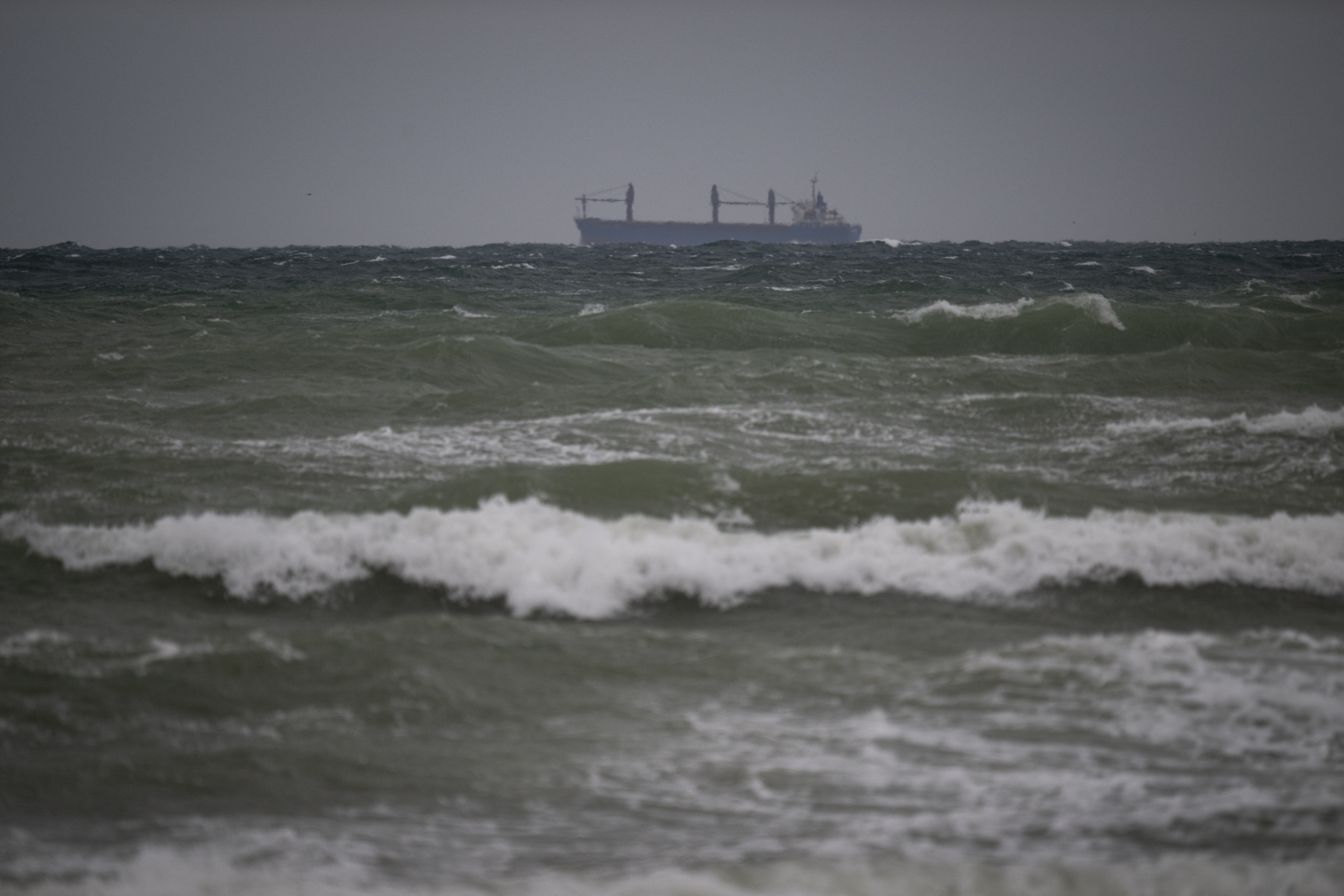 A cargo ship is pictured in the Black Sea in Krapets, on October 14, 2026, a day after suspected Russian drones struck two cargo ships off Bulgaria, sinking one vessel and leaving 11 sailors missing in the latest spillover from the Ukraine war in the Black Sea.
