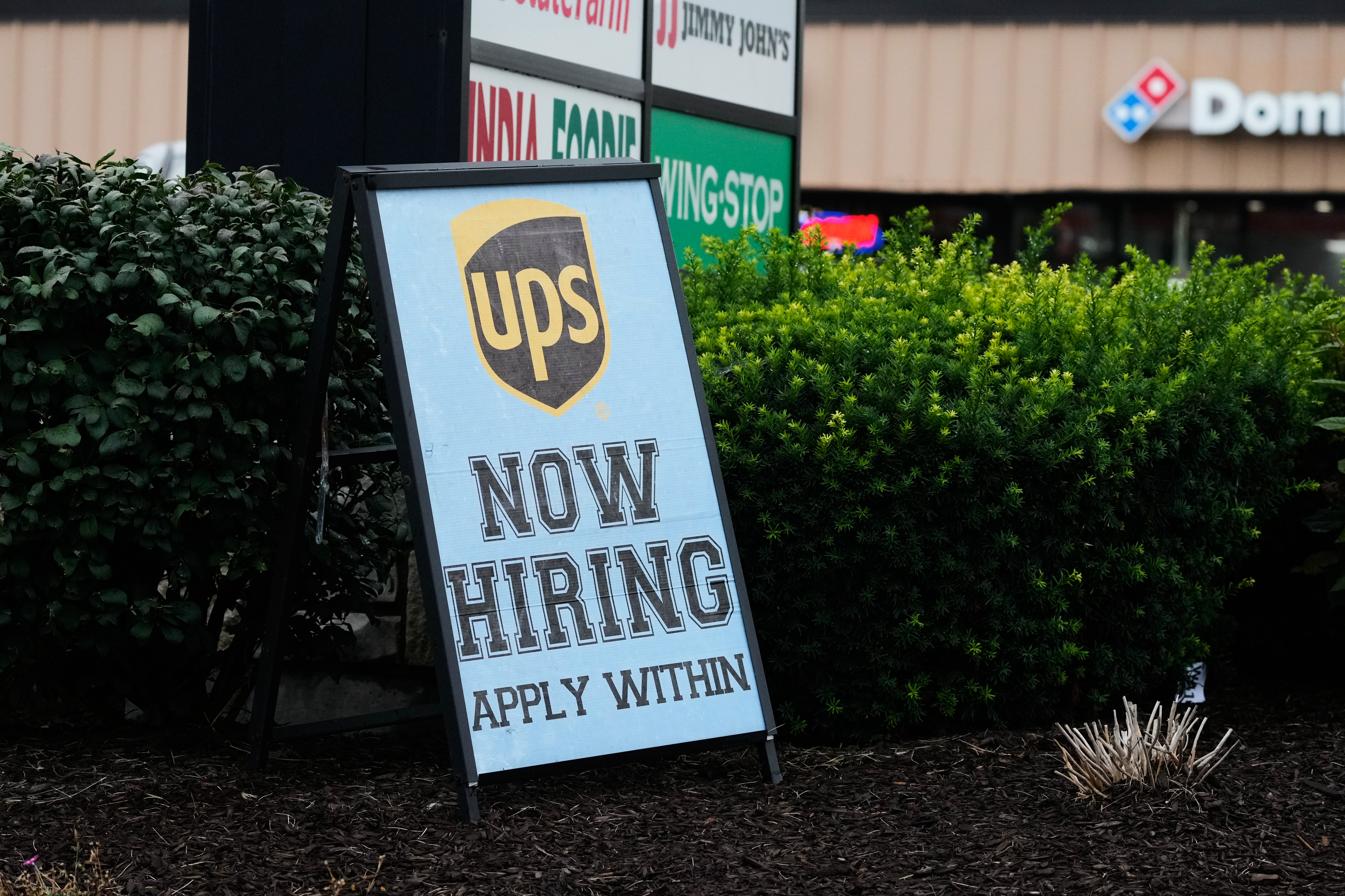 A now hiring sign is displayed outside of a UPS store, in Streamwood, Ill., Wednesday, Sept. 16, 2026. (AP Photo/Nam Y. Huh)