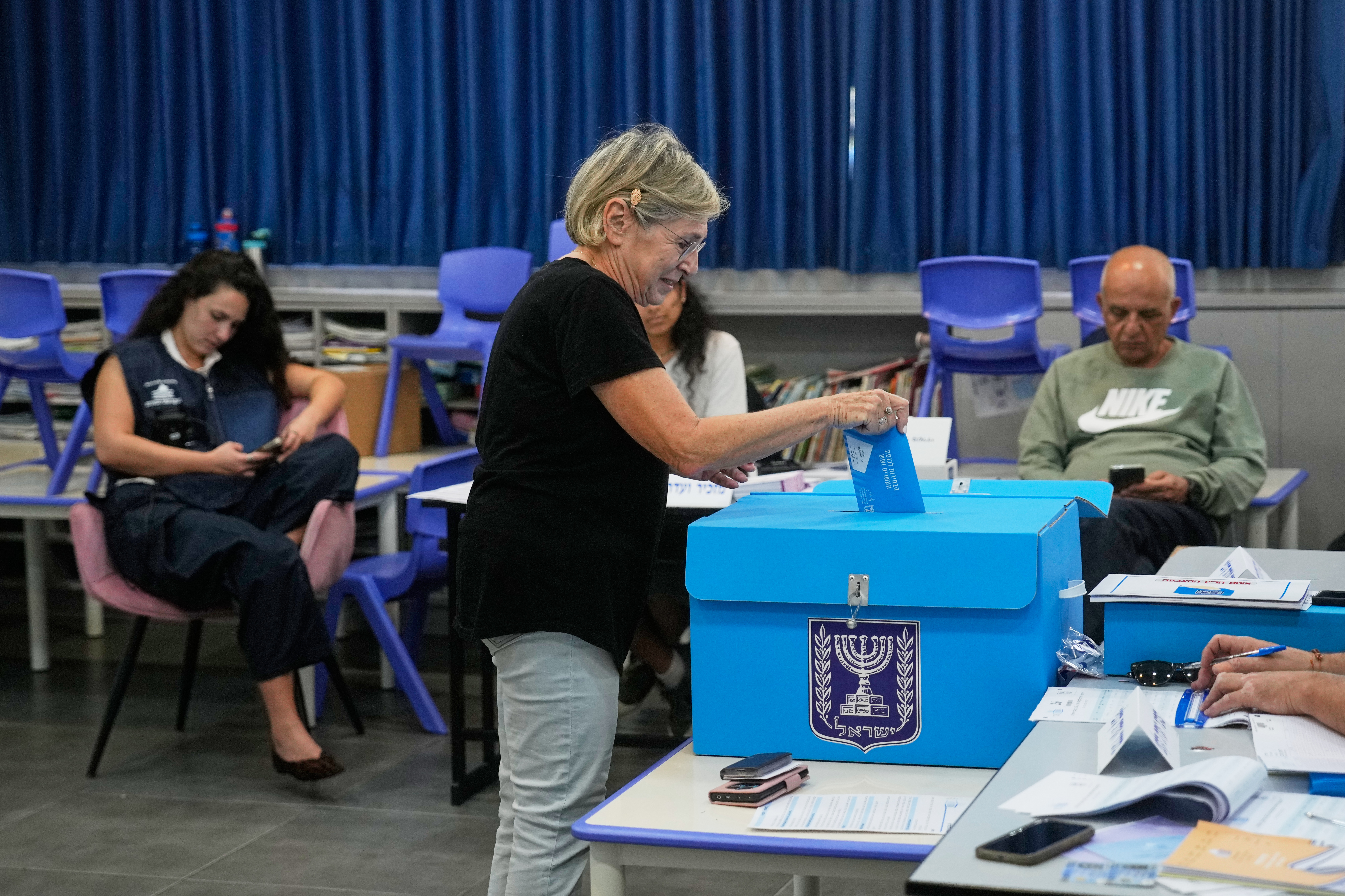 A woman casts her ballot at a polling station during Israel's general election in Jerusalem, Tuesday, Oct. 27, 2026. (AP Photo/Ohad Zwigenberg)