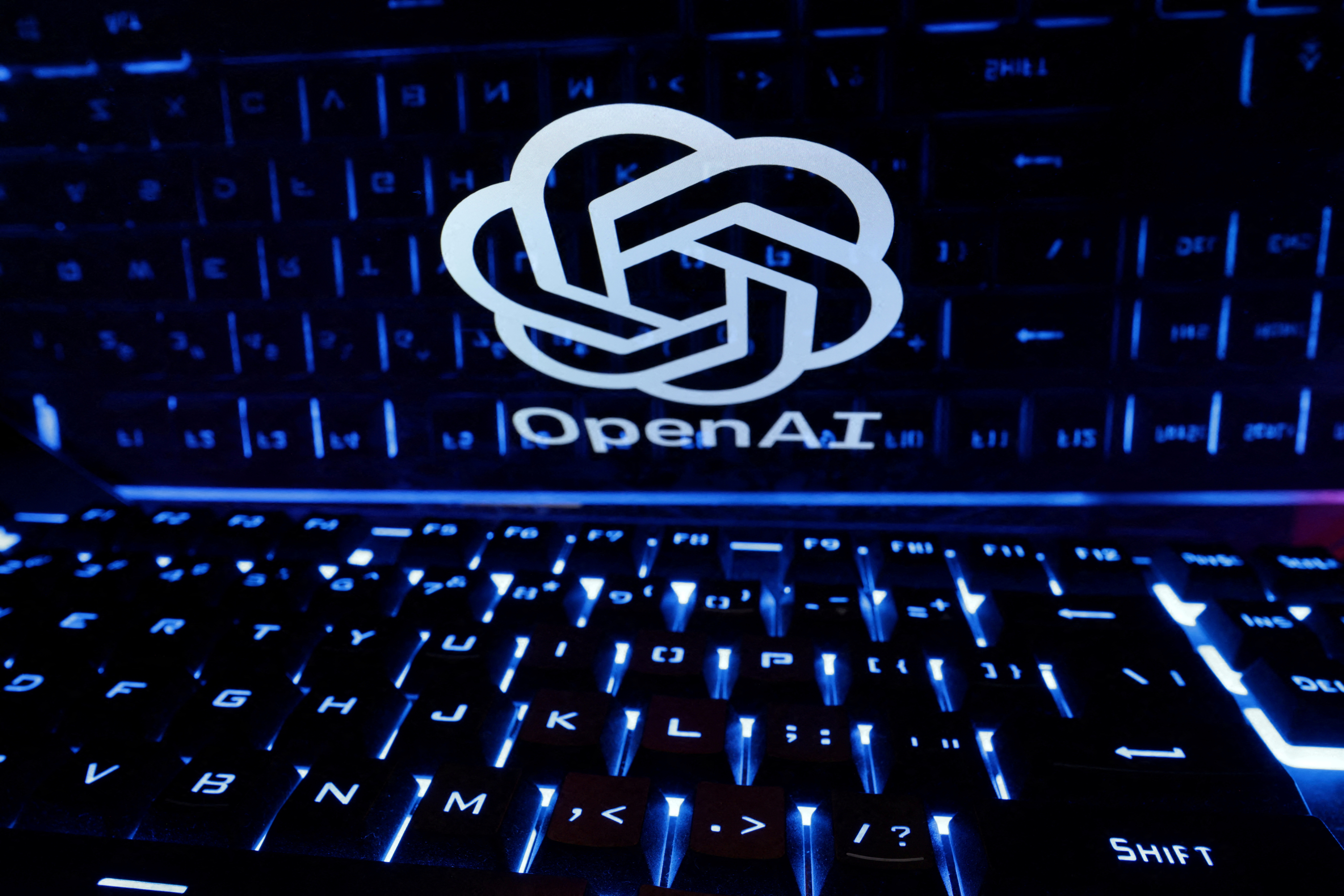 FILE PHOTO: FILE PHOTO: A keyboard is placed in front of a displayed OpenAI logo in this illustration taken February 21, 2023. REUTERS/Dado Ruvic/Illustration/File Photo/File Photo